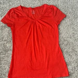 Marona size small dark coral, short sleeve V-neck. Lightweight soft stretch.